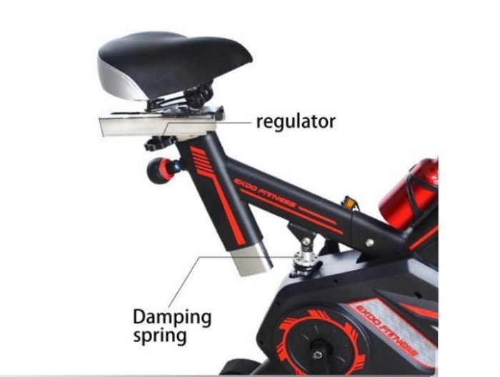 Spinning bike with toe cage pedals and padded seat
