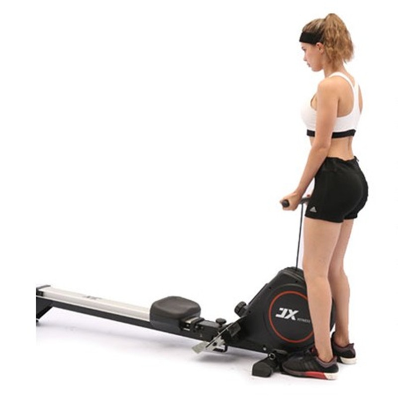 Rowing machine seat rail and footplates